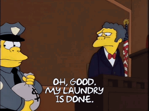 Police Officer Holding Money Bag Saying Oh Good My Laundry Is Done
