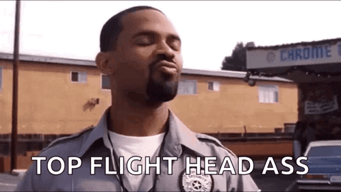 Police Officer In Front Of Building Eyes Closed GIF