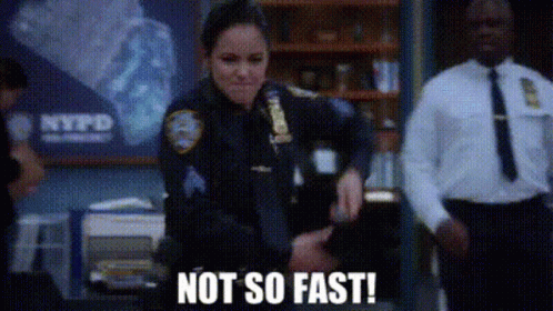 Police Officer in Front of NYPD Sign