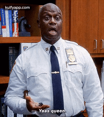 Police Officer In White Shirt With Key Saying Yaas Queen GIF