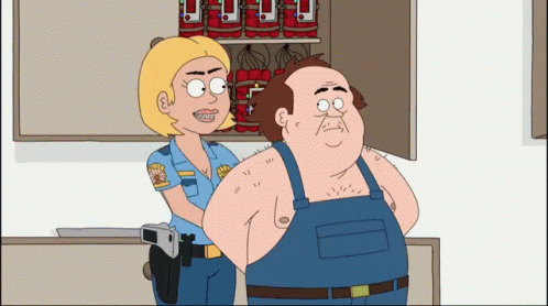 Police Officer Next to Handcuffed Man