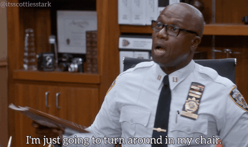 Police Officer Sitting At Desk Says I'm Just Going To Turn Around In My Chair