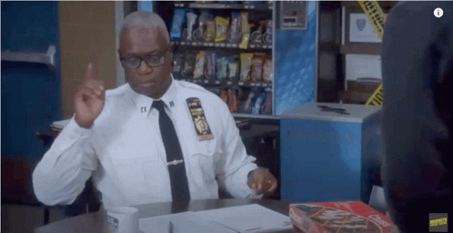 Police Officer Sitting With Box Of Chex Mix