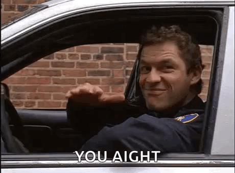 Police Officer Smiling in Car