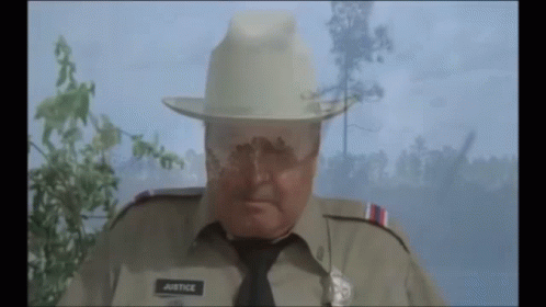 Police Officer With Justice On Uniform GIF