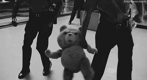Police Officers Holding Teddy Bear