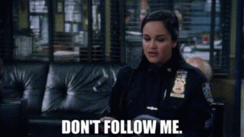 Police Woman Sitting on Couch Don't Follow Me