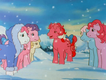 Ponies Standing In Snow With Bow On Tail GIF