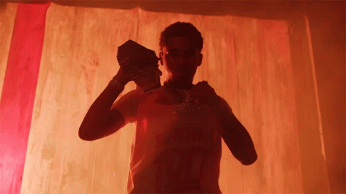 Pooh Shiesty Against The Light Holding Chain GIF