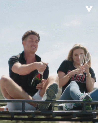 Couple Popping Champagne GIF