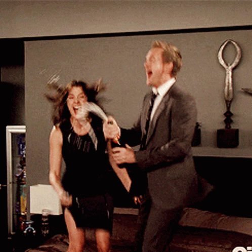 Celebrating Couple Champagne Popping GIF