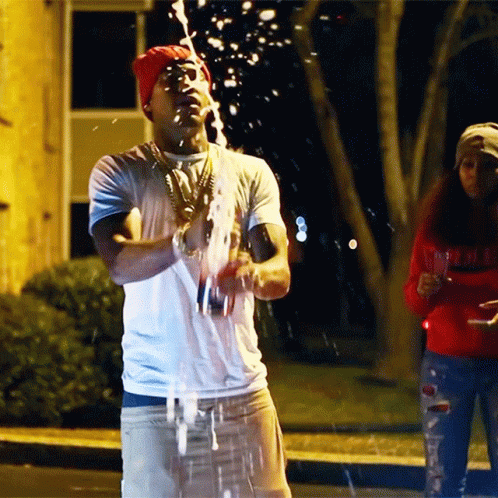 Popping Champagne Bottle On The Street GIF