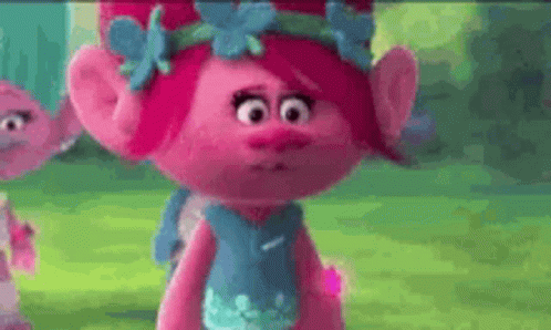 Poppy From Trolls Is Wearing A Blue Dress With Flowers On It . GIF
