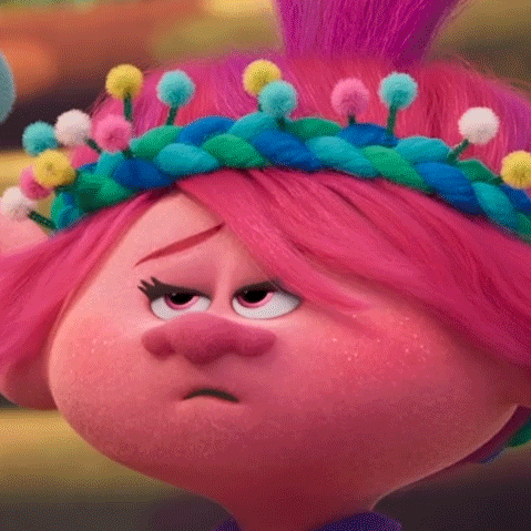 Poppy From Trolls Is Wearing A Crown Of Pom Poms On Her Head And Making A Sad Face . GIF