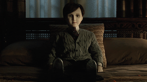 Porcelain Doll Sitting Terror GIF