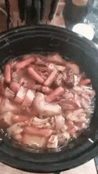Potluck Putting Meat In The Pot GIF
