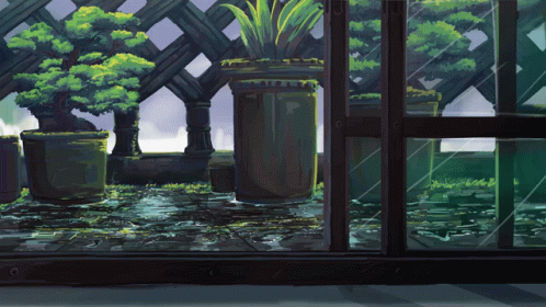 Potted Plants in Front of Fence