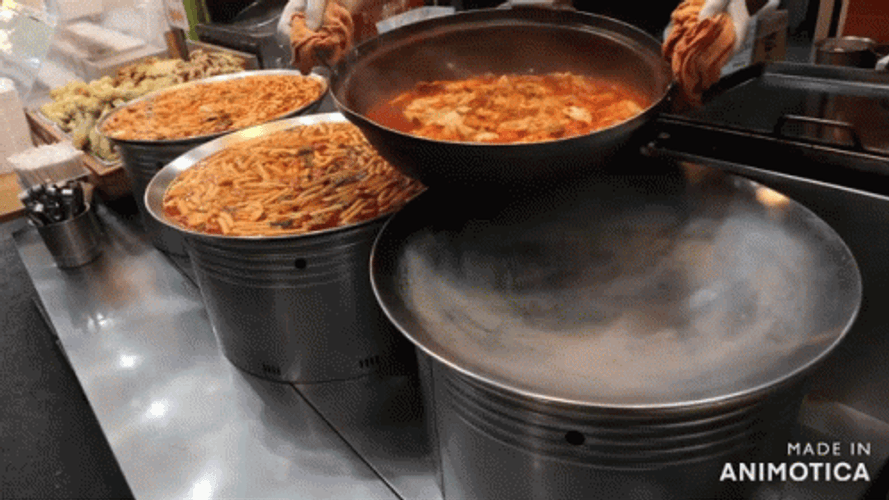 Pouring Big Pot Of Curry GIF