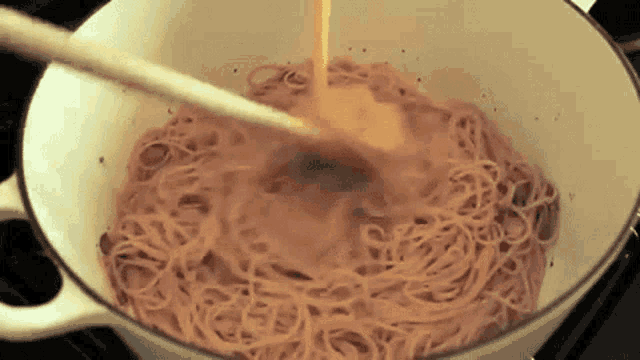 Pouring Creamy Sauce On Pasta GIF