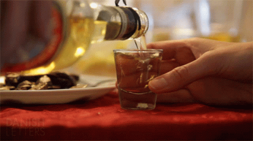 Pouring Drink from Bottle with Danish Letters
