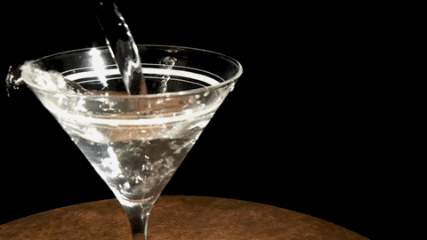 Pouring Two Shots Of Vodka On Cocktail Glass GIF