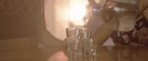 Pouring Two Shots Of Vodka On Glass GIF