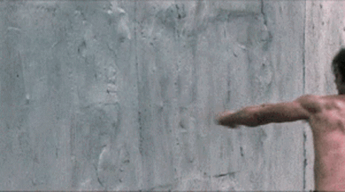 Man Punch The Wall With Power GIF
