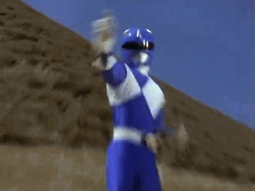 Power Ranger in Blue and White Holding Item
