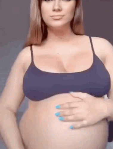 Pregnant Woman Dancing Holding Belly GIF