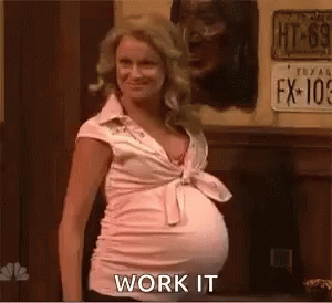 Pregnant Woman in Pink Shirt Saying Work It