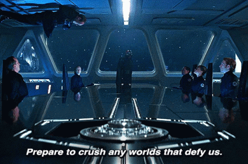 Prepare To Crush Any Worlds That Defy Us Is Written Above A Group Of People GIF
