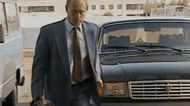 President Putin Walking With Briefcase And Shakes Hand GIF