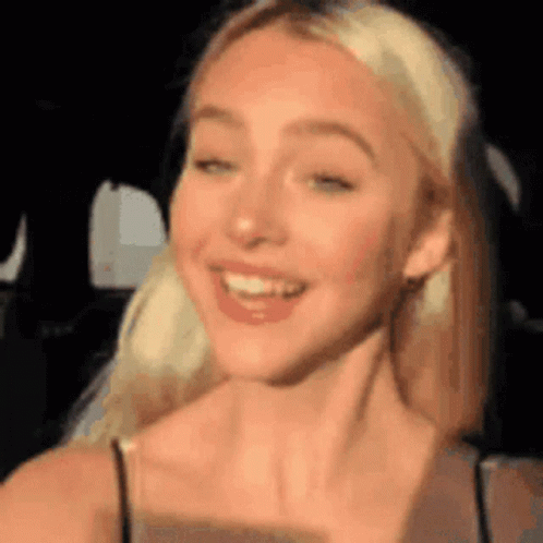 Pretty Blonde Vlogger Fixing Hair GIF