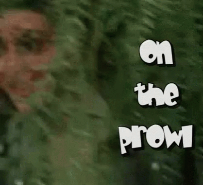 Pretty Cougar Kim Kardashian Peeking Behind Tree GIF