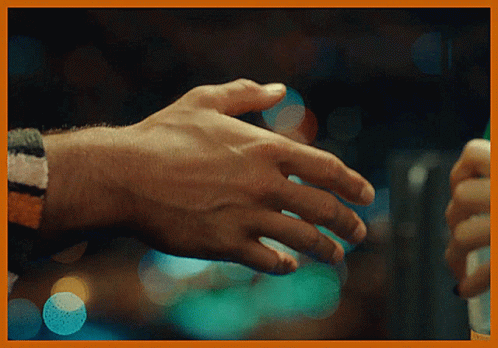 Pretty Girl And Handsome Guy Shaking Hands GIF