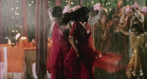 Pretty Indian Ladies Dancing In Monsoon GIF