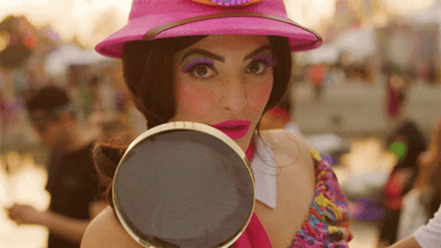 Pretty Lady Holding Magnifying Glass GIF