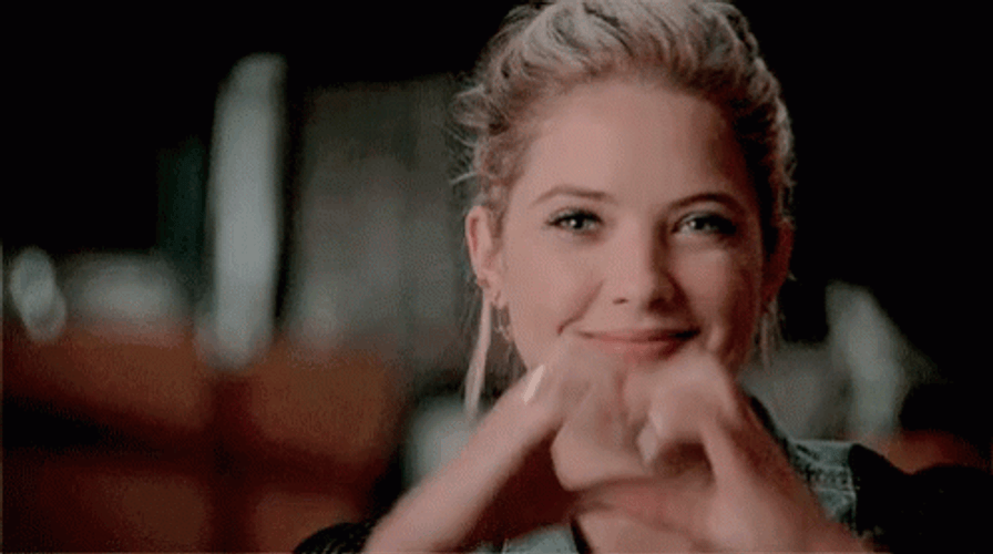Pretty Lady Shows Moving Heart Hands GIF
