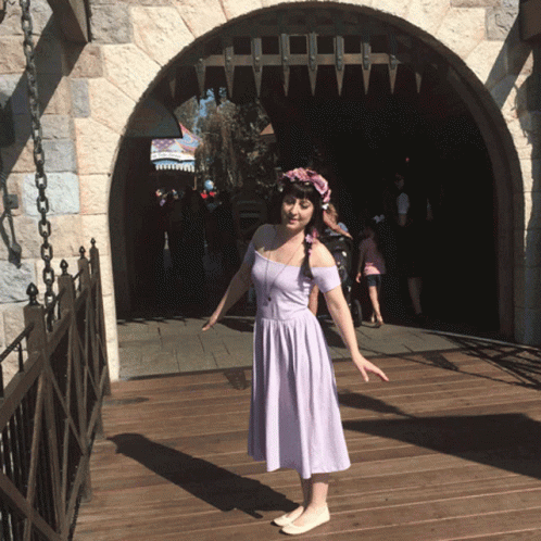 Pretty Lady Twirls In Disneyland GIF