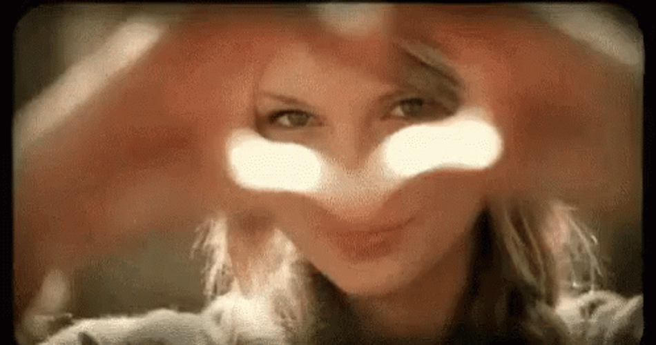 Pretty Smiling Eyes Inside Heart Hands GIF