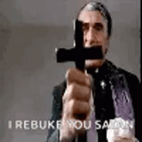 Priest Holding Cross I Rebuke You Satan GIF
