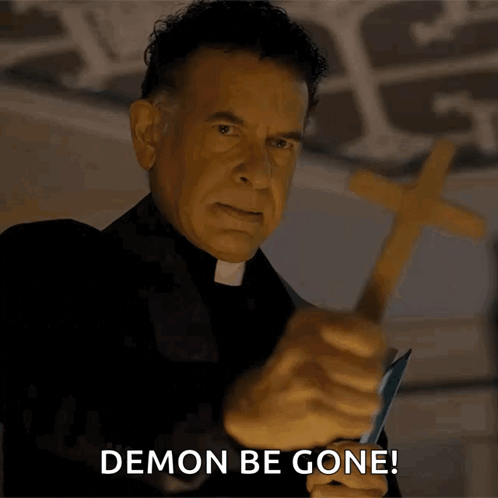 Priest Holding Cross Saying Demon Be Gone