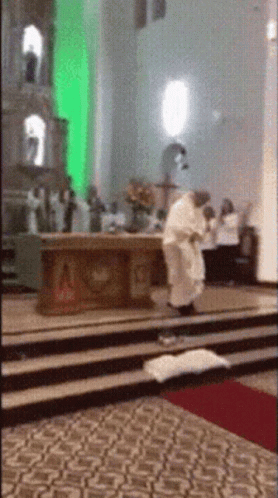 Priest Kneeling Before Altar