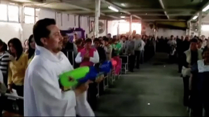 Priest Water Gun Spraying Holy Water GIF