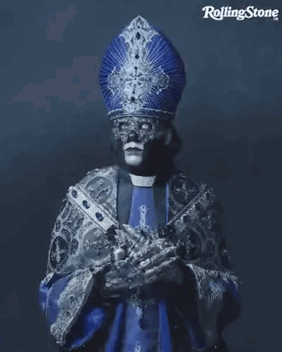 Priest With Mask Holding Cross
