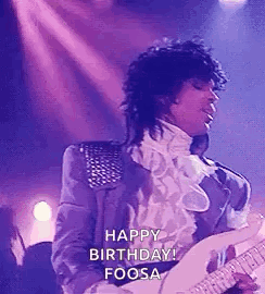 Prince Is Playing A Guitar On Stage And Saying Happy Birthday . GIF