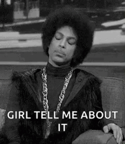 Prince Is Sitting On A Couch With His Eyes Closed And A Necklace Around His Neck . GIF
