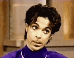 Prince Is Wearing A Purple Turtleneck And Making A Funny Face GIF