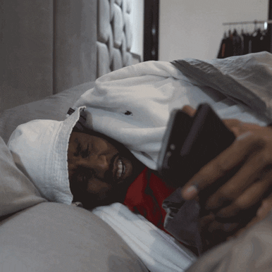 Puff Diddy Checking Out Phones GIF