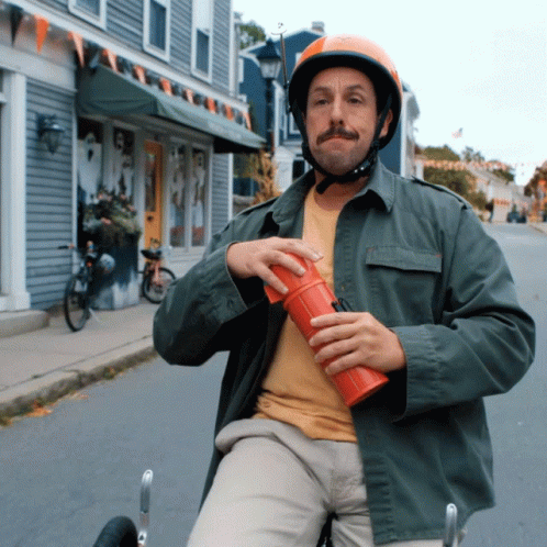 Adam Sandler Puking While Riding Bike GIF